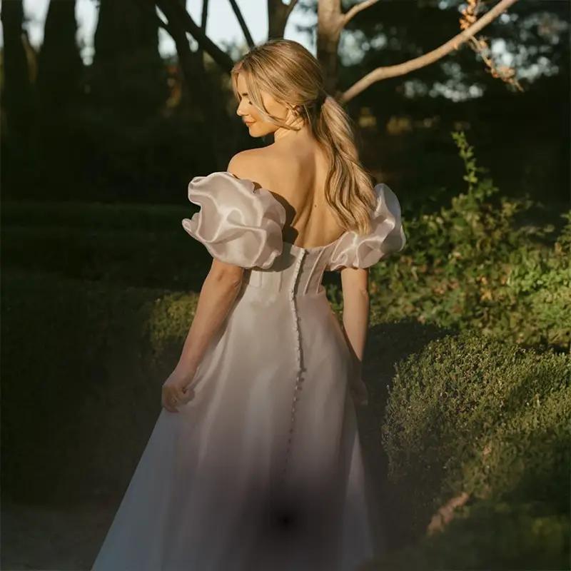 Model wearing a white gown